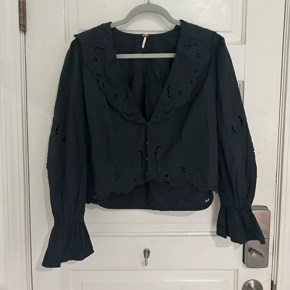 FREE PEOPLE eyelet embroidered black top.